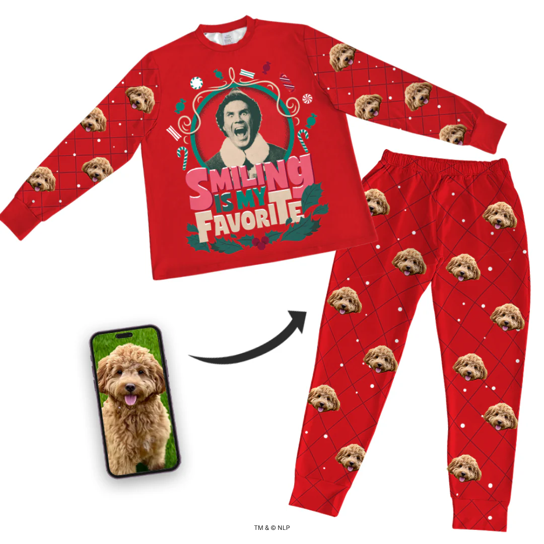 Red pajama set featuring a holiday design and dog faces, with a phone displaying a dog's photo.