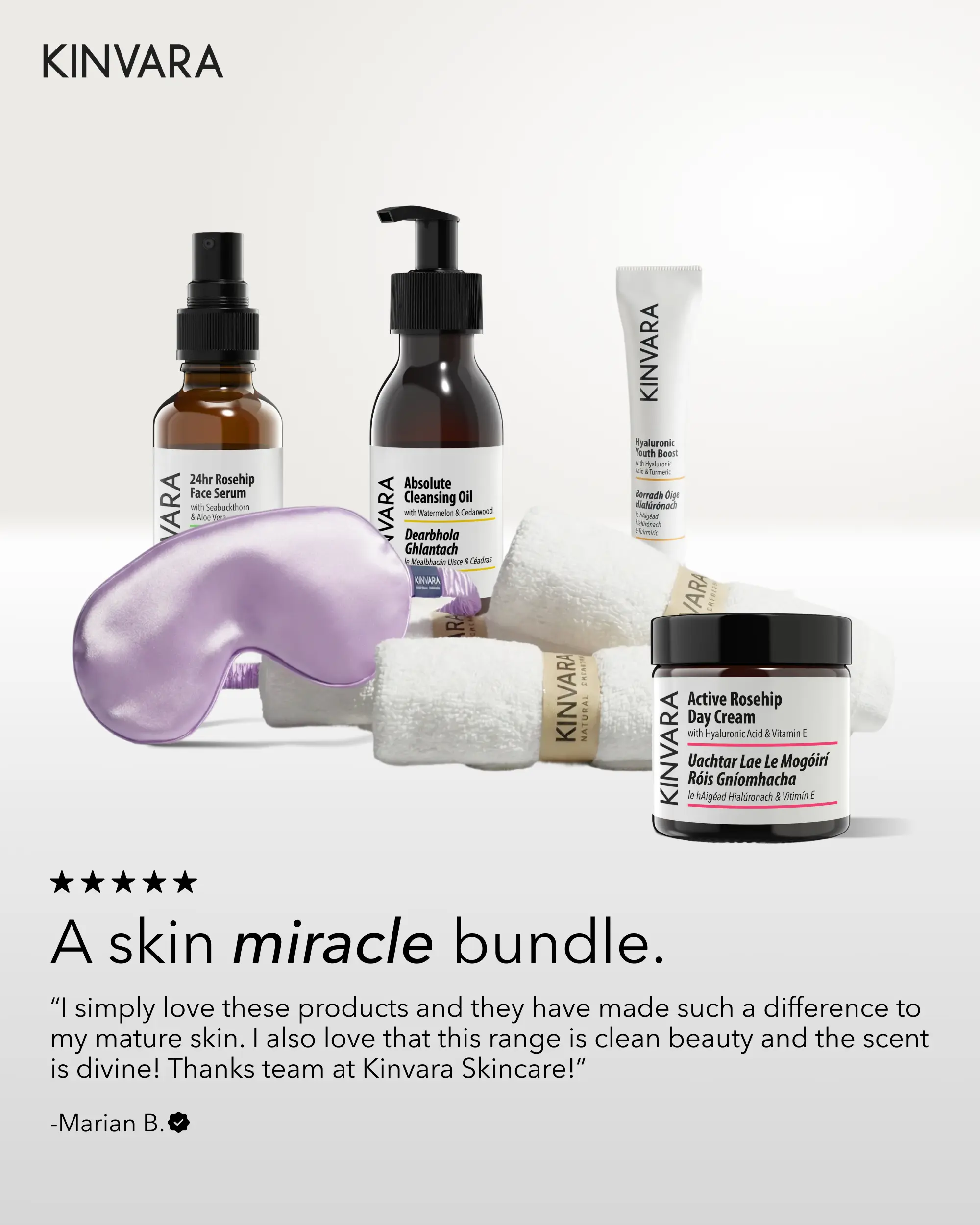 A collection of Kinvara skincare products is displayed with a purple eye mask and rolled white towels.