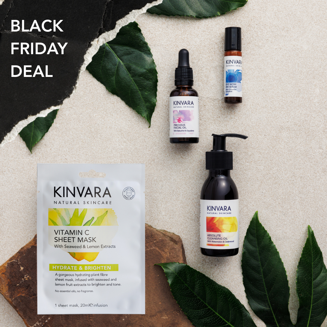 Skincare products with green leaves on beige background, Black Friday deal text.