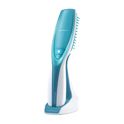 A blue and white handheld Hairmax laser comb device sitting in its charging base against a white background.