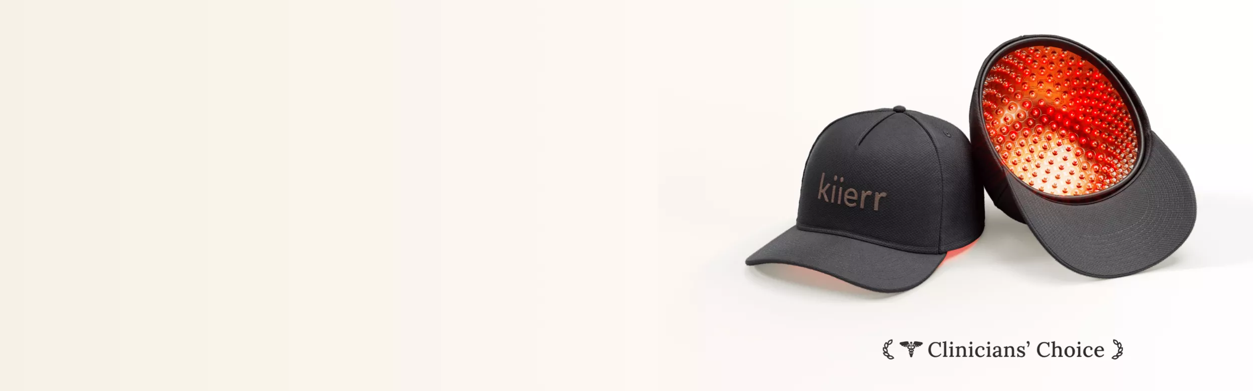 Two black caps, one with red lights inside, on a light background.