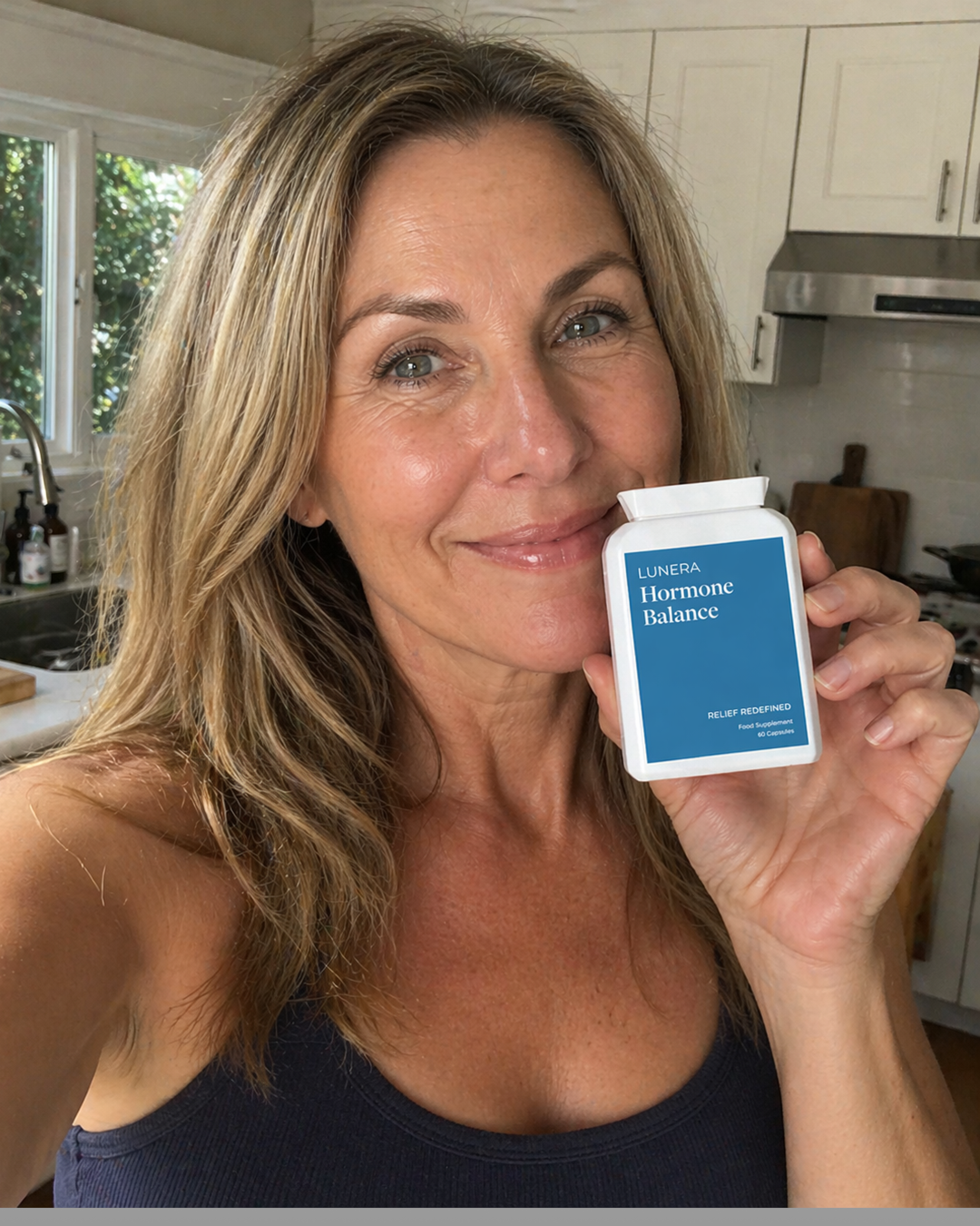 A smiling woman with blonde hair holds up a white bottle of Lunera Hormone Balance supplements.