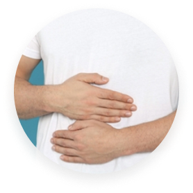 Person in white shirt holding stomach with both hands.