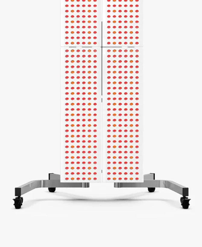 Tall white panel with red dots on a wheeled stand.