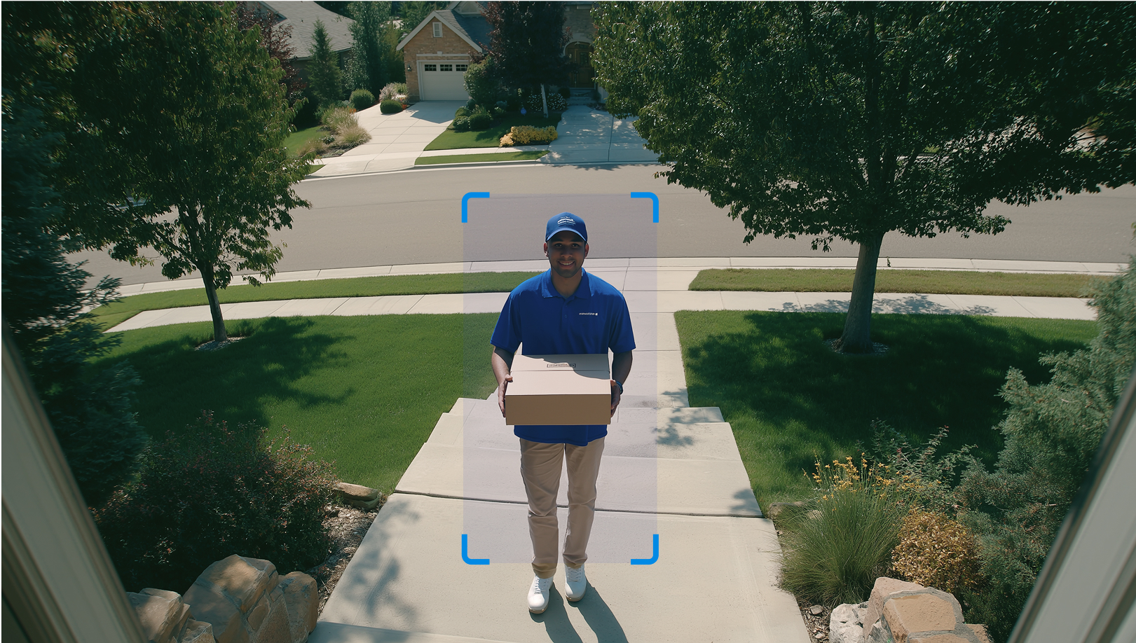 Delivery person holding a package on a doorstep, highlighted by an auto-tracking frame