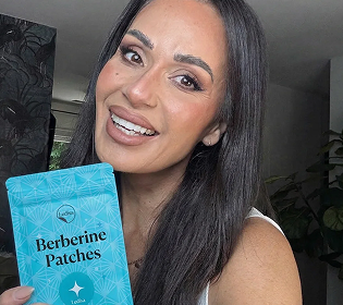 A smiling woman with dark hair holds up a blue pouch labeled 'Berberine Patches'.