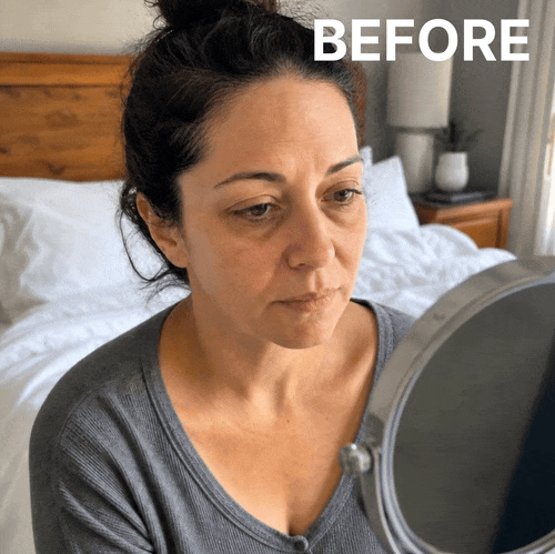 Woman looking at the appearance of her under-eye area
