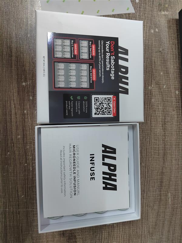 AlphaInfuse box opened with serum vials and micro-infusion device