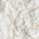 Close-up view of a textured white powder surface.