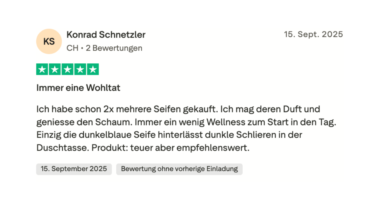 Review of soaps with a five-star rating and text description in German.