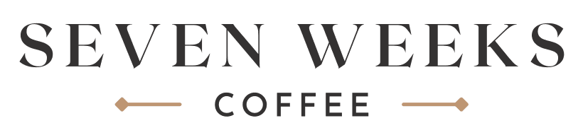 The logo for Seven Weeks Coffee, shown in black and tan text against a white background.