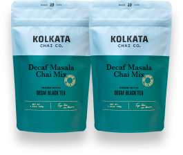 Two pouches of Kolkata Chai Co. Decaf Masala Chai Mix against a white background.