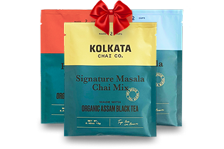 Three colorful tea bags with a red ribbon on top.