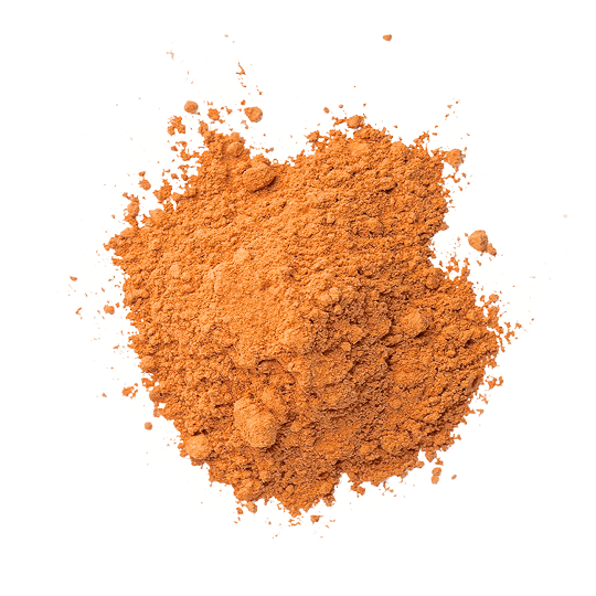A top-down view of a pile of fine, orange-colored powder on a white background.