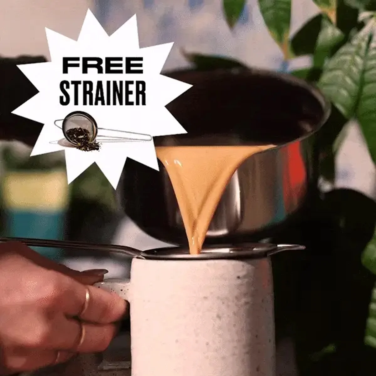 A person pours tea from a saucepan through a strainer into a mug with a 'Free Strainer' graphic.