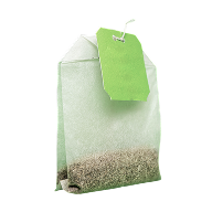 A teabag with loose tea visible inside and a blank green tag, against a white background.