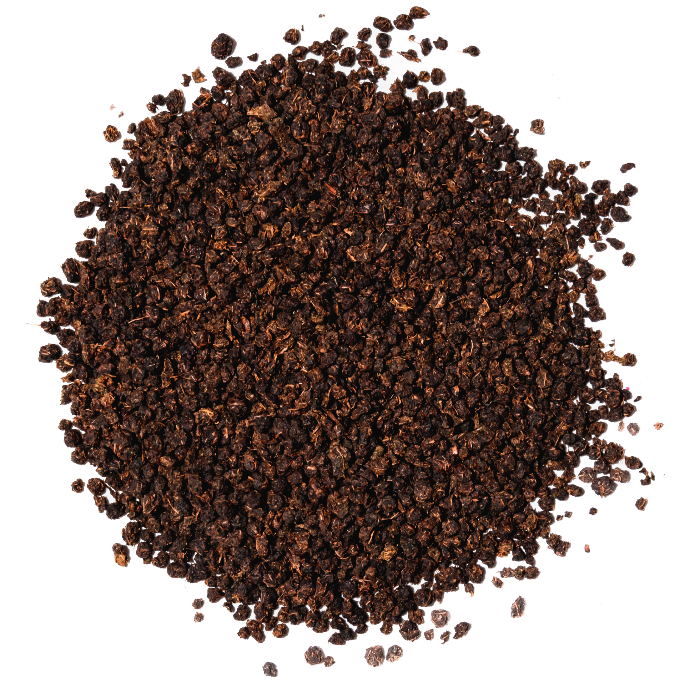 A pile of loose, dark brown granules on a white background.