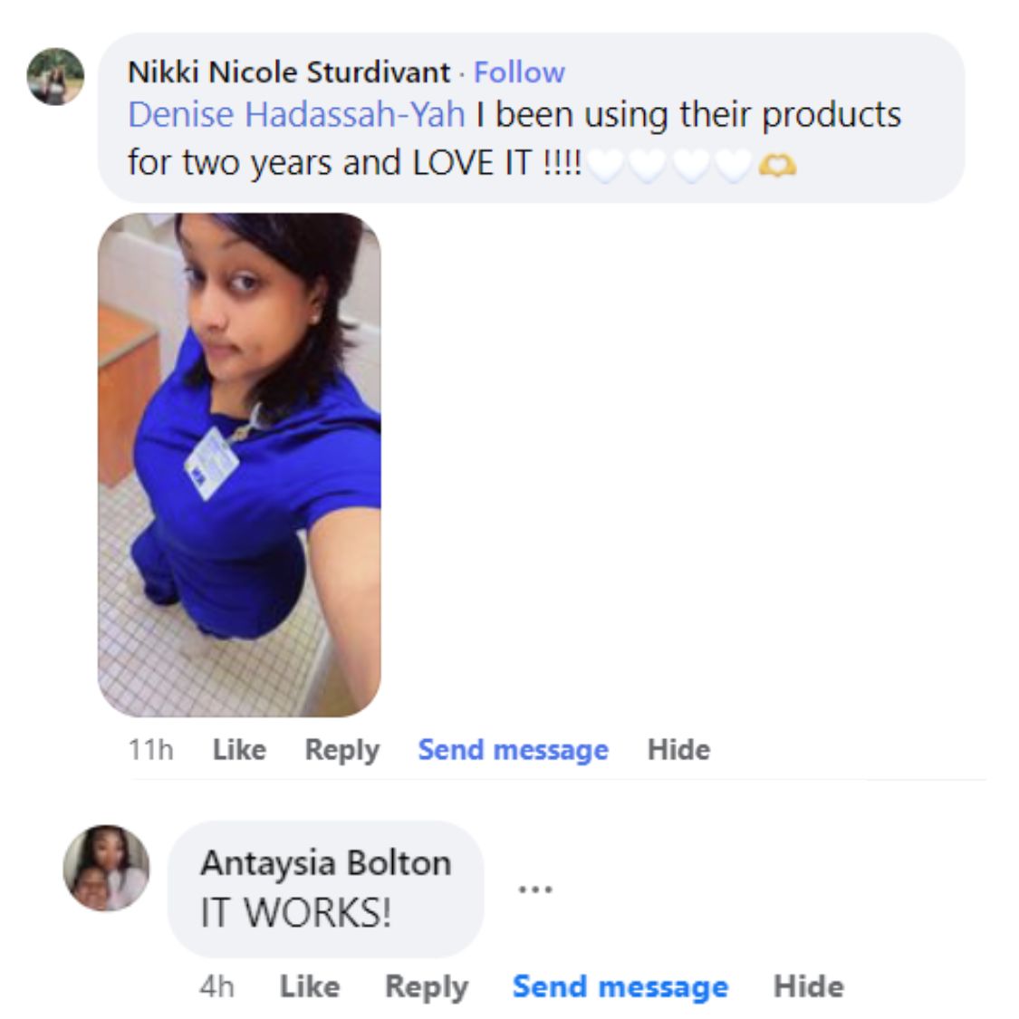 Person in blue scrubs taking a selfie in a tiled room.