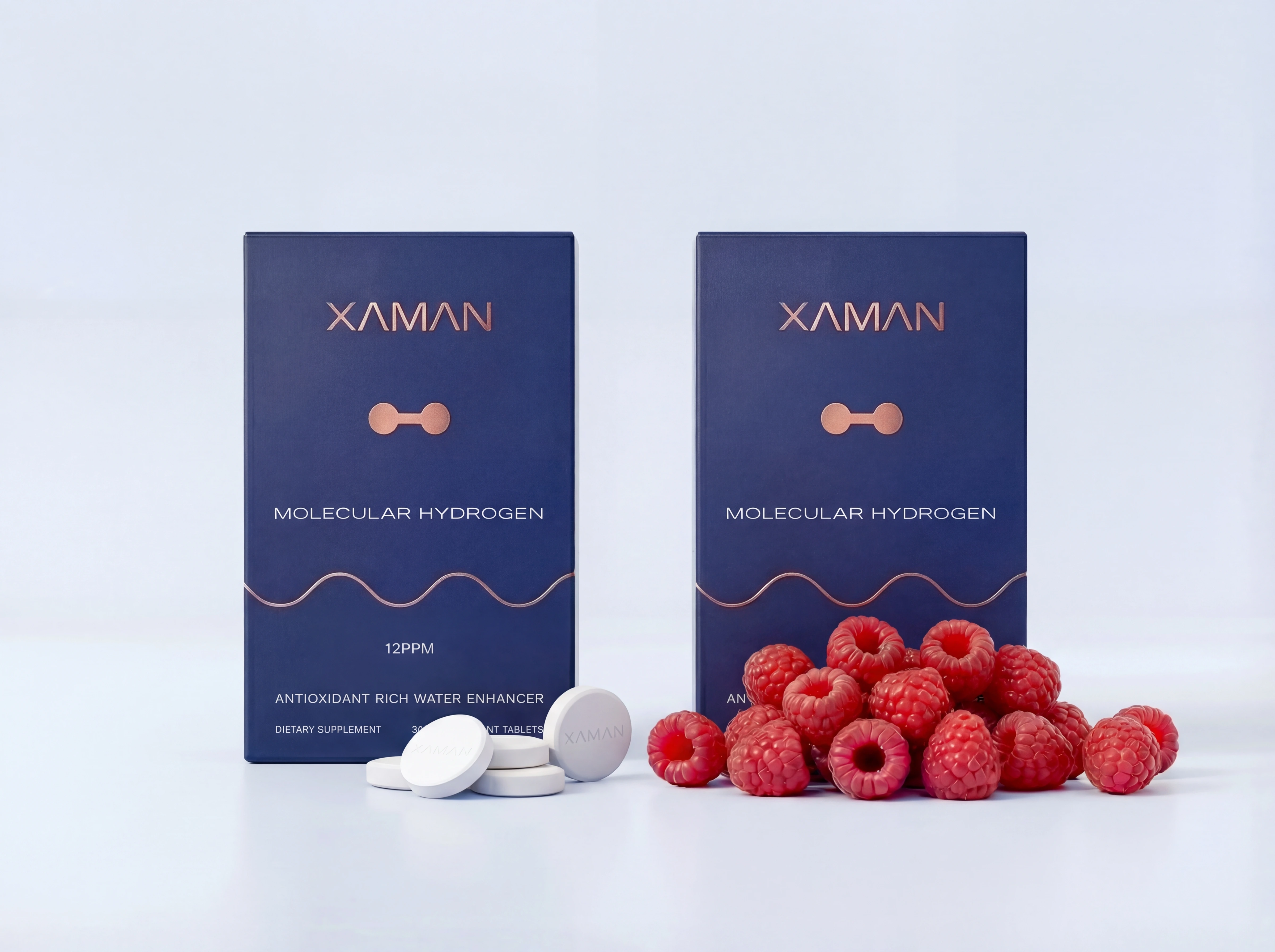 Two boxes of XAMAN Molecular Hydrogen supplement with white tablets and a pile of fresh raspberries.