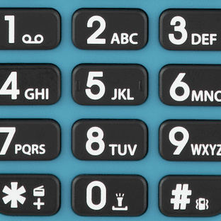 Close-up of a telephone keypad with numbers and letters.