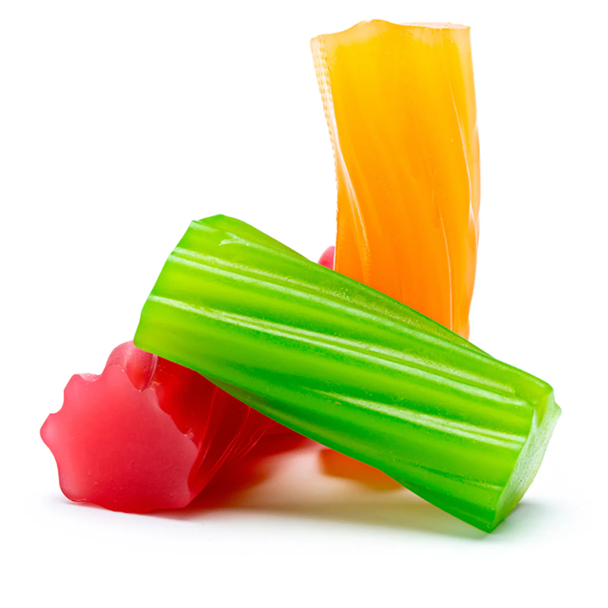 Assorted colorful gummy candies, green, red, and orange, on a white background.
