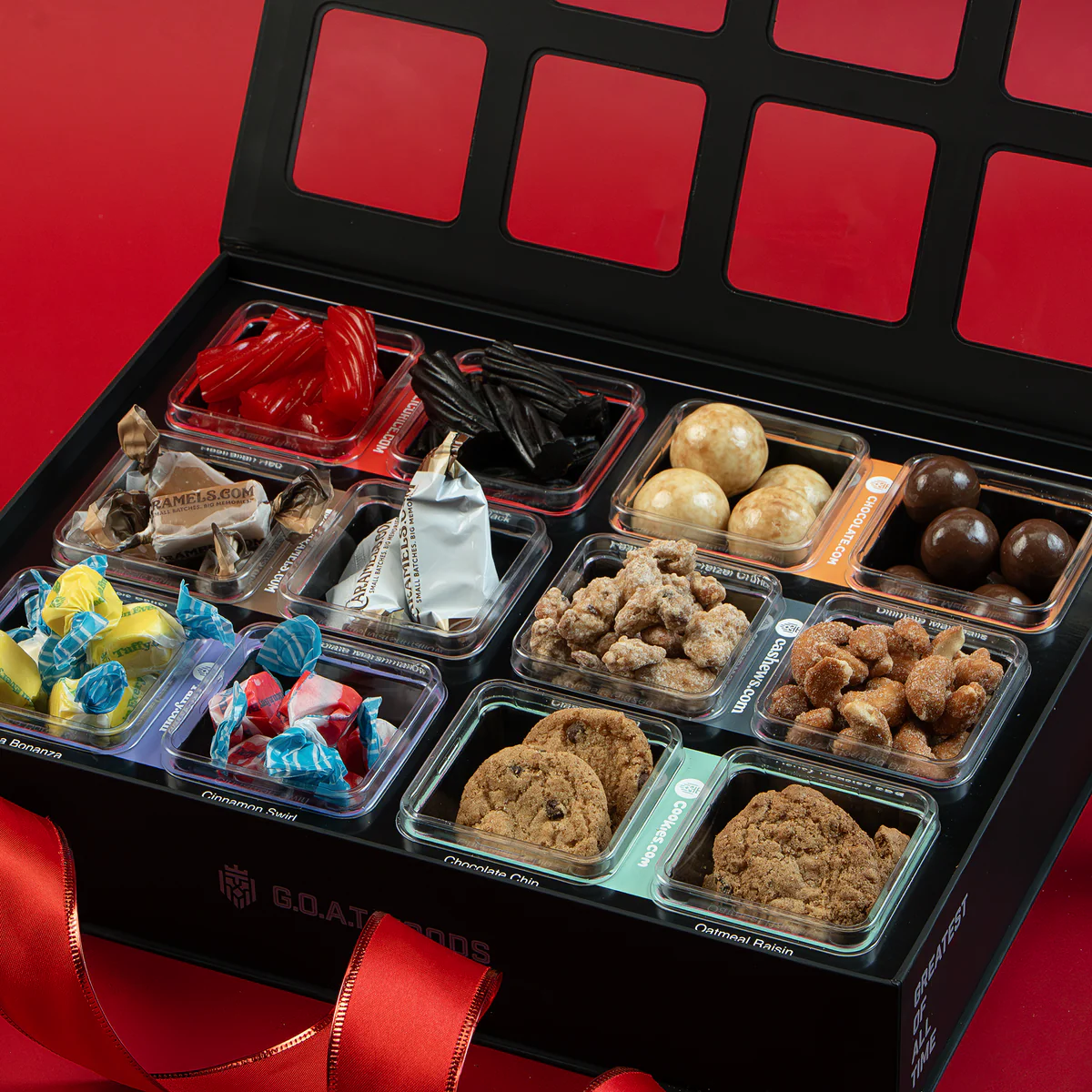 Box of assorted candies and cookies in individual compartments.