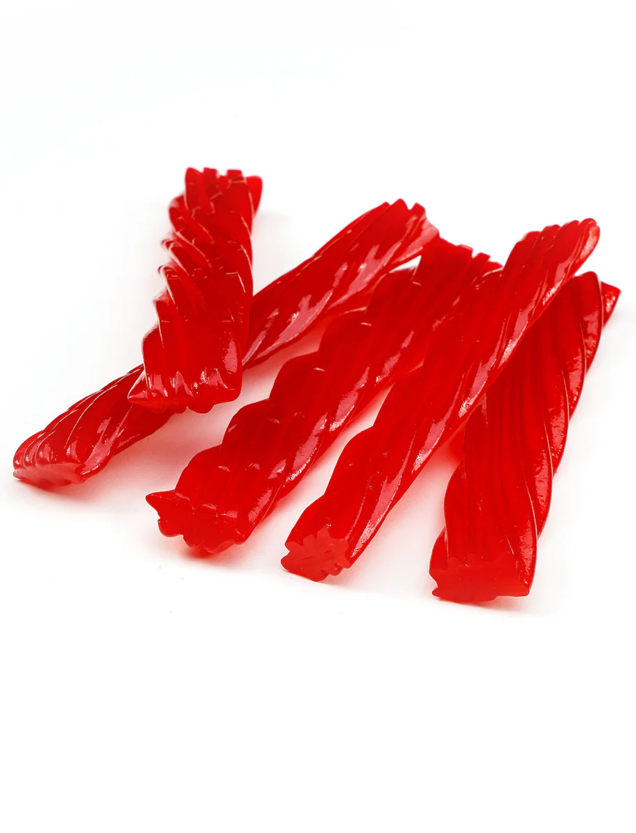 Red twisted licorice pieces on a white background.