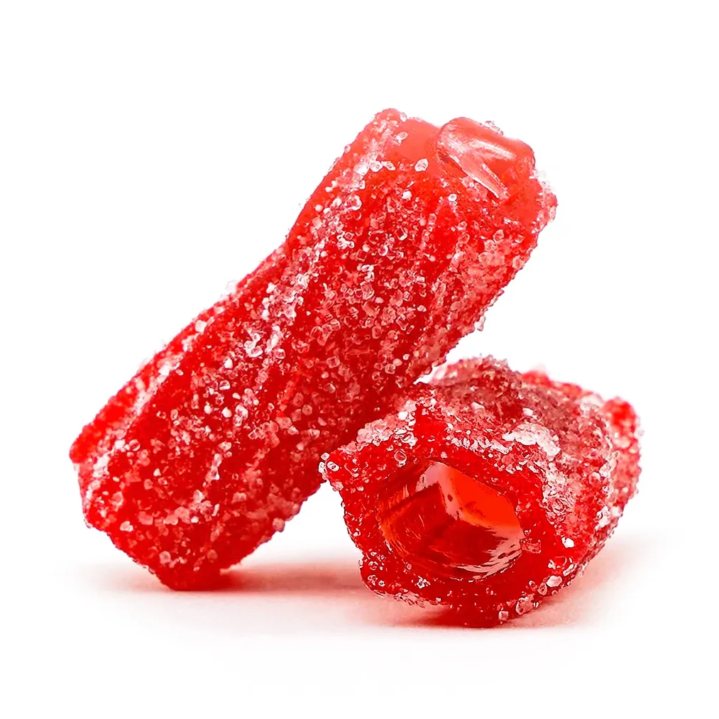A close-up of two pieces of red, hollow, sugar-coated candy against a white background.