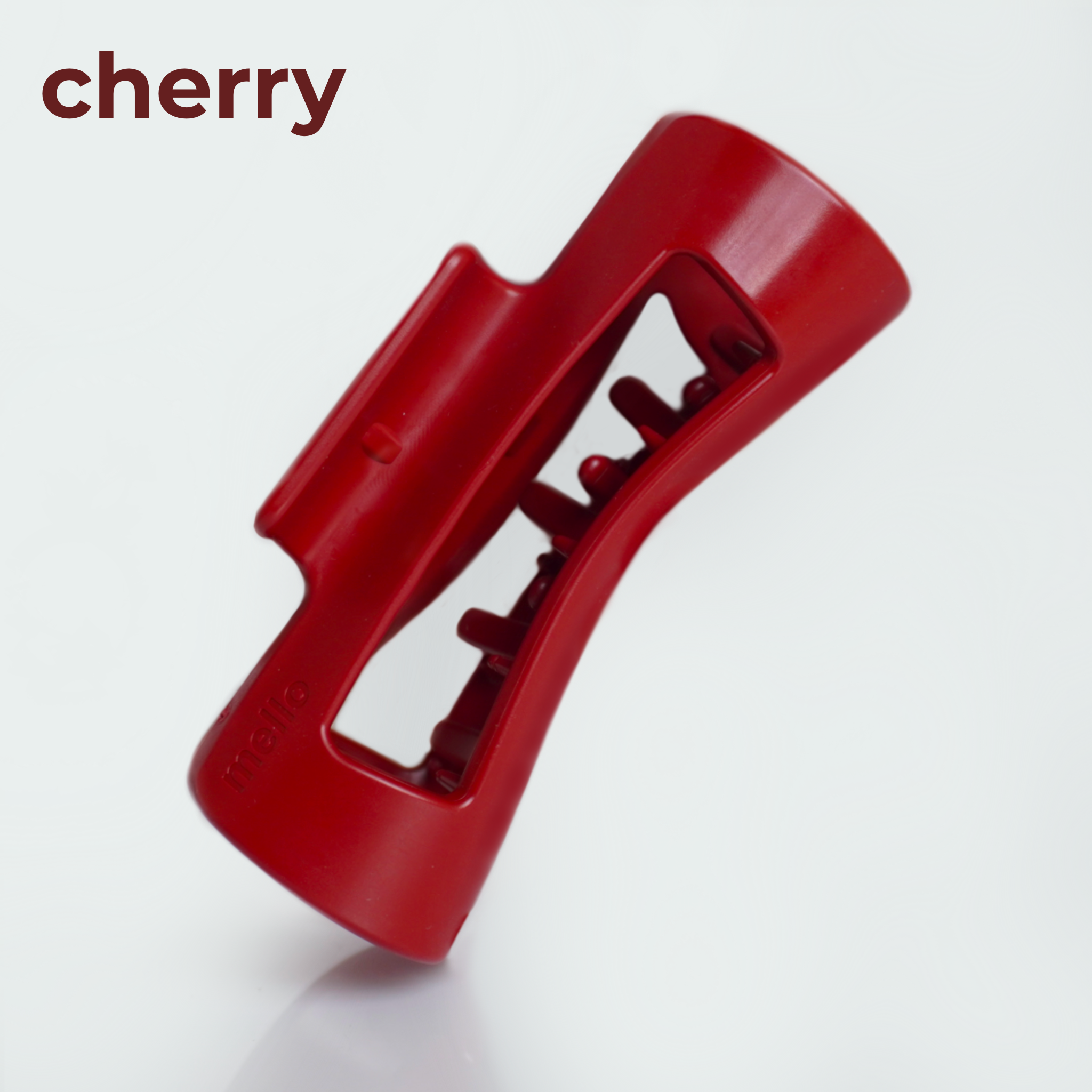 Red plastic clip against a white background with 'cherry' text.