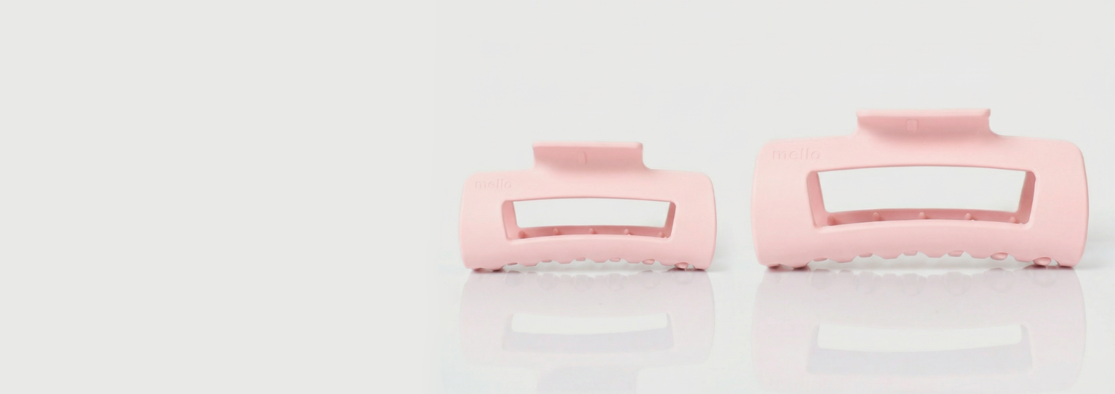 Japanese snack box with tea, snacks, and utensils against a red background.