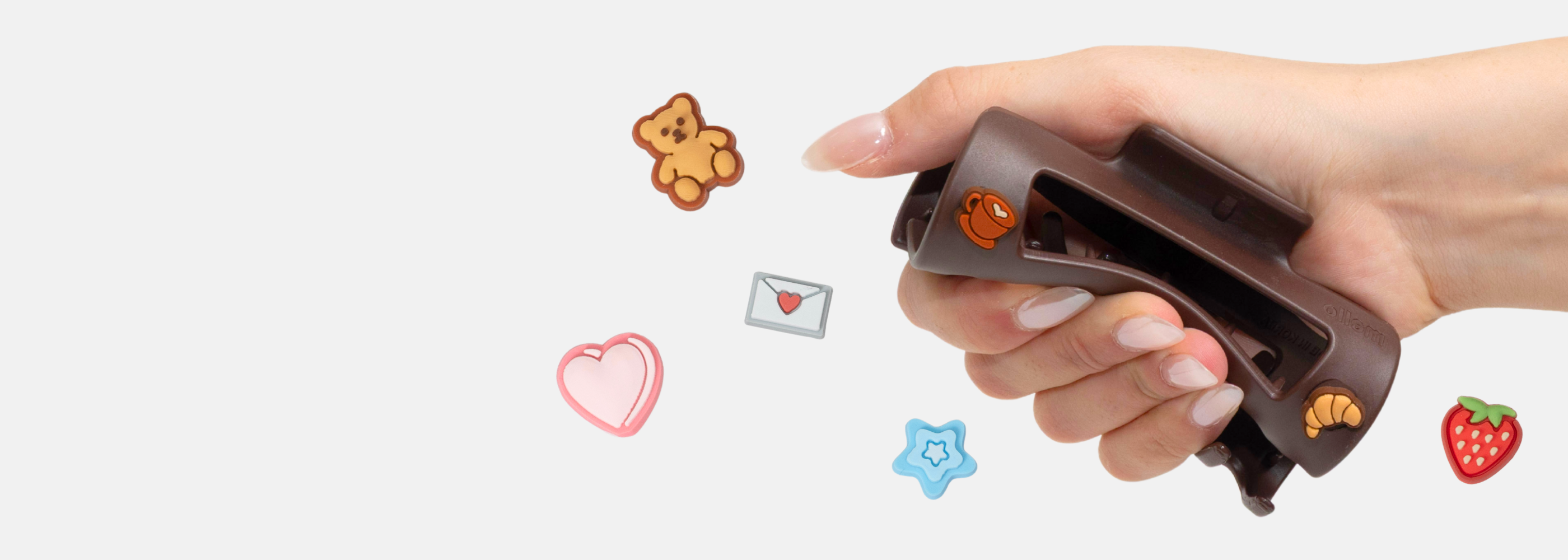 Japanese snack box with tea, snacks, and utensils against a red background.