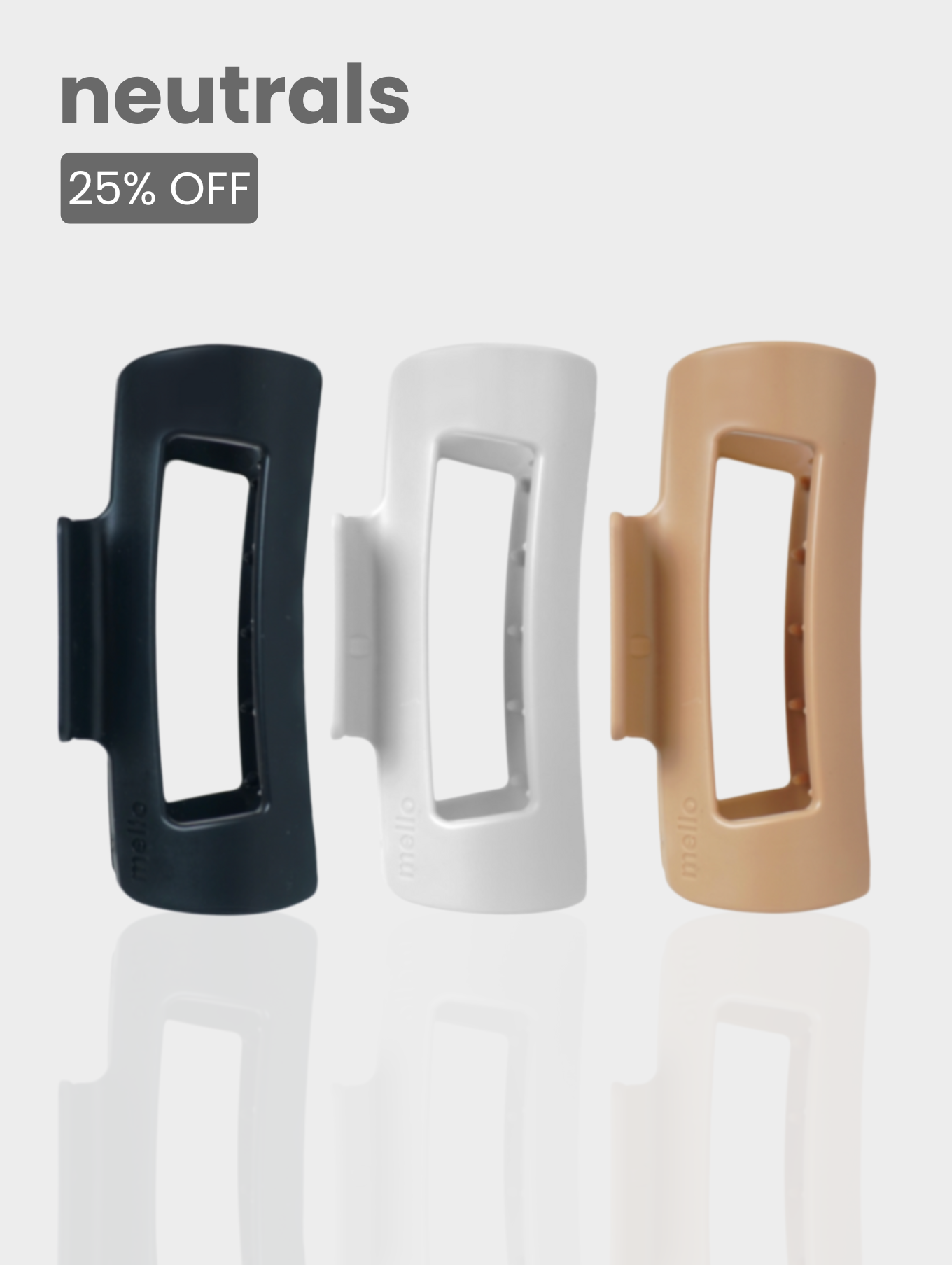 Three hair claw clips in black, white, and beige with 'neutrals 25% off' text.