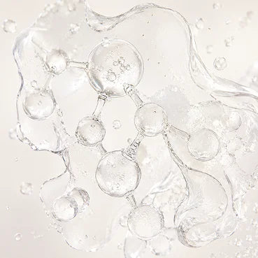 A molecular structure made of clear liquid surrounded by water splashes against a white background.