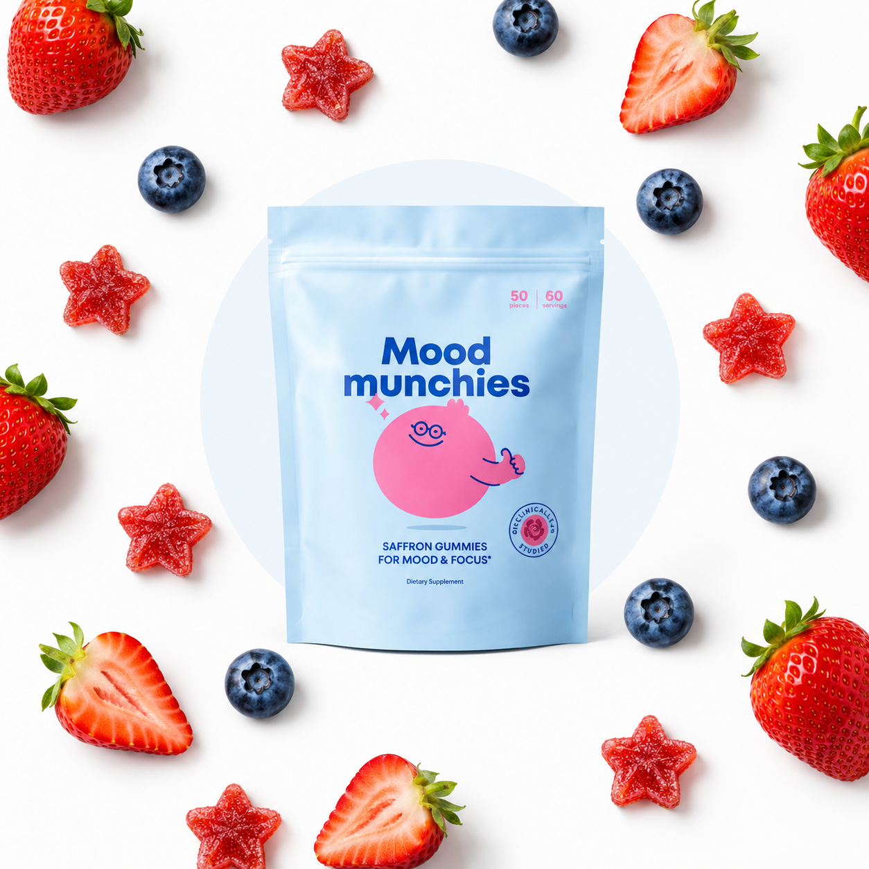 A blue pouch of Mood munchies saffron gummies surrounded by strawberries, blueberries, and red star-shaped gummies.