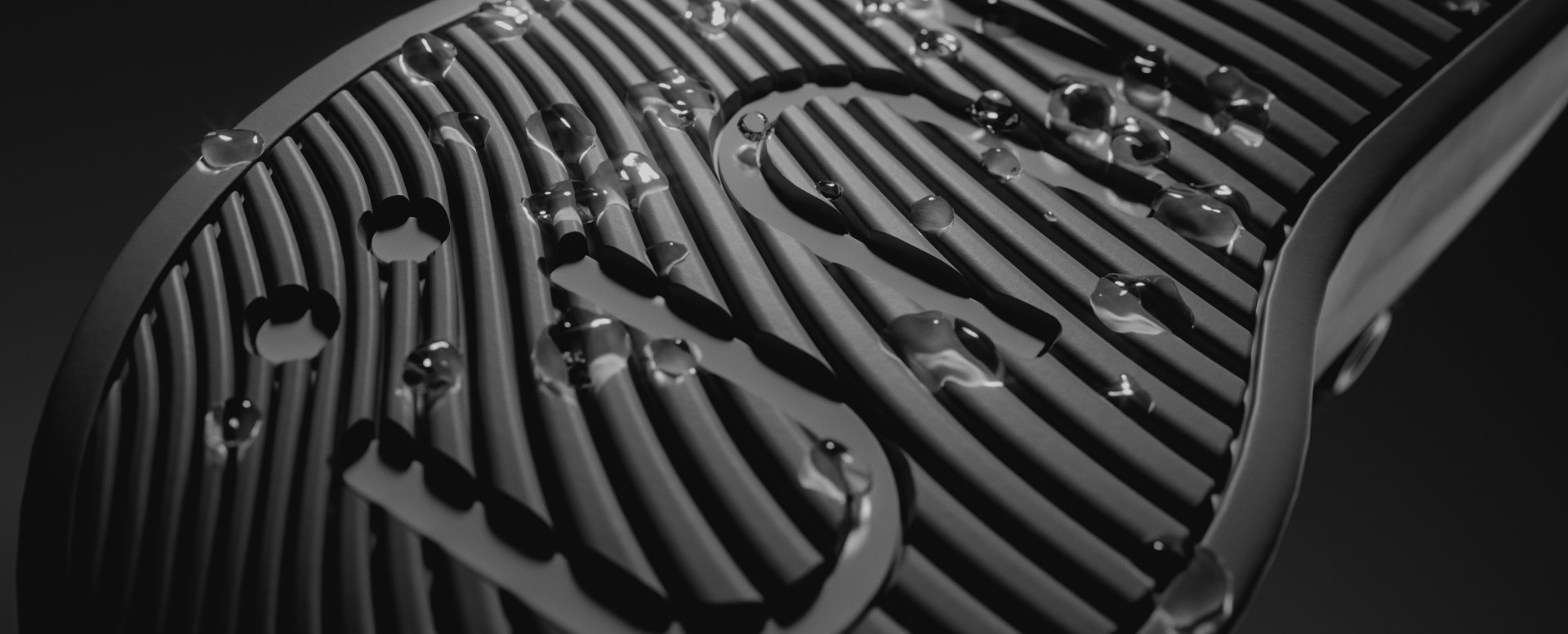 Close-up of a shoe sole with water droplets on it.
