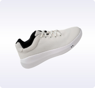 White sneaker with black interior on a light background.