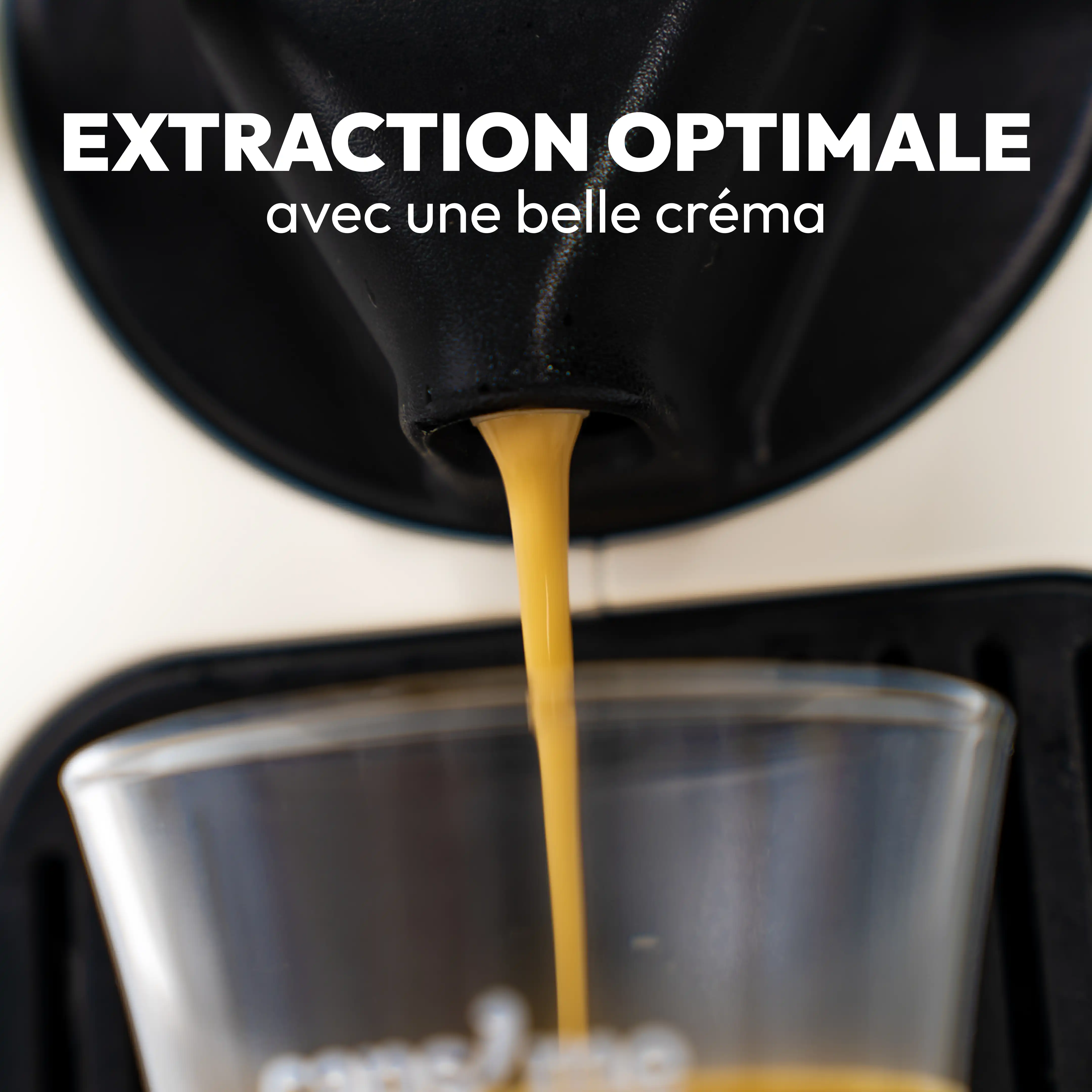 Coffee being poured from a machine into a glass with text overlay.