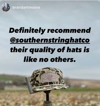 Camouflage hat on a stand with text recommending Southern String Hat Co.