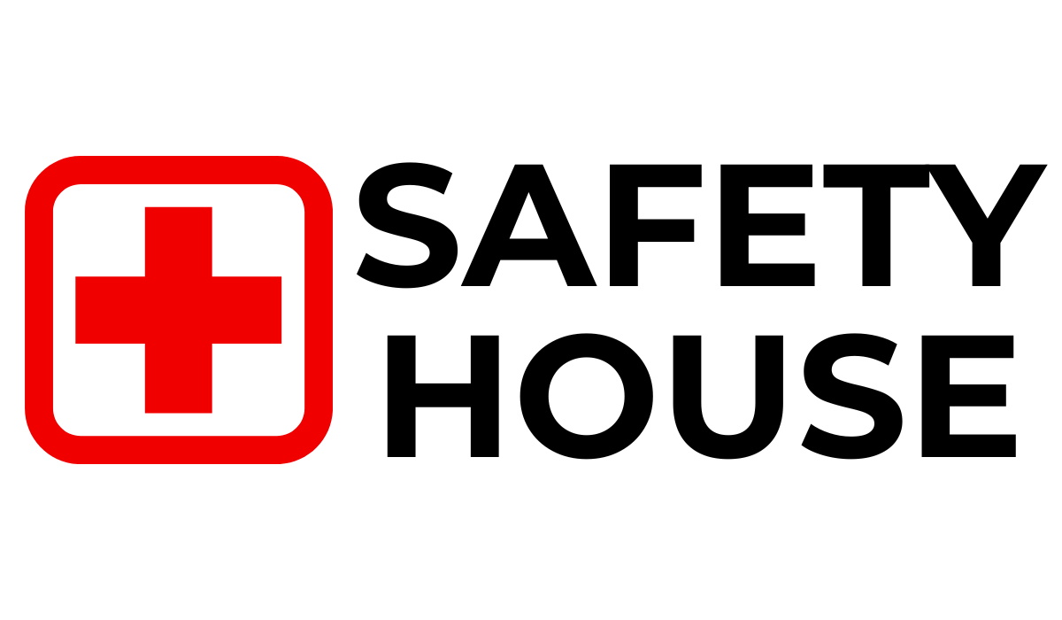 Red cross symbol inside a square with text 'First Aid'.