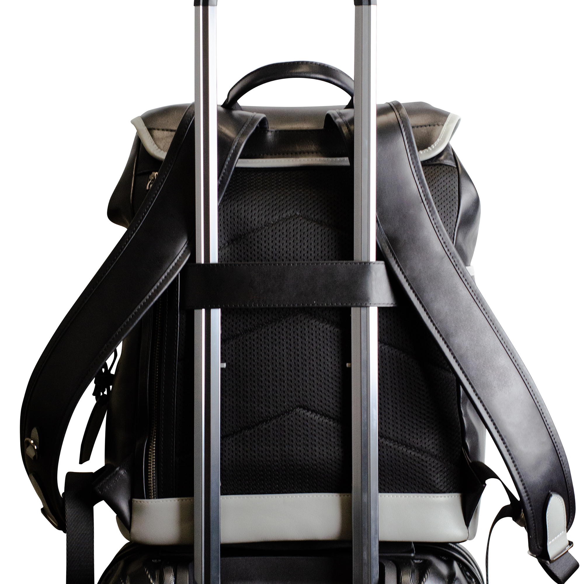 Backpack attached to a rolling suitcase handle, isolated on white background.