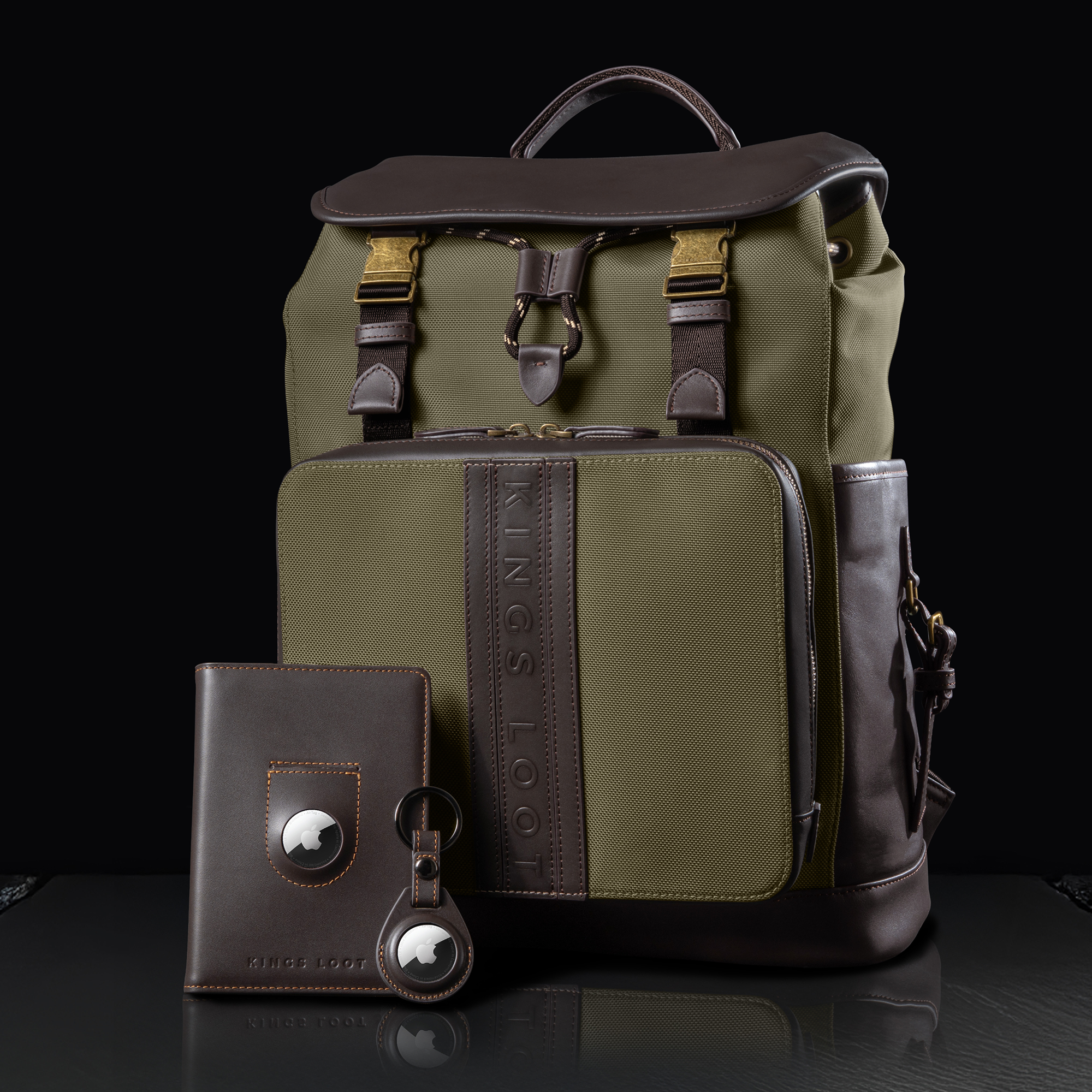 Green and brown backpack with matching wallet and keychain on black background.