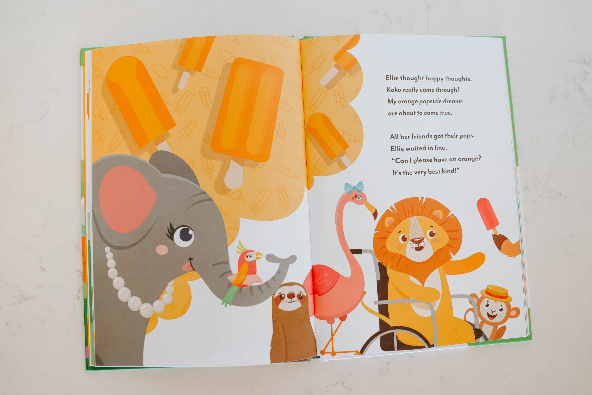 An open children's book with an illustration of various animals, including a lion in a wheelchair.