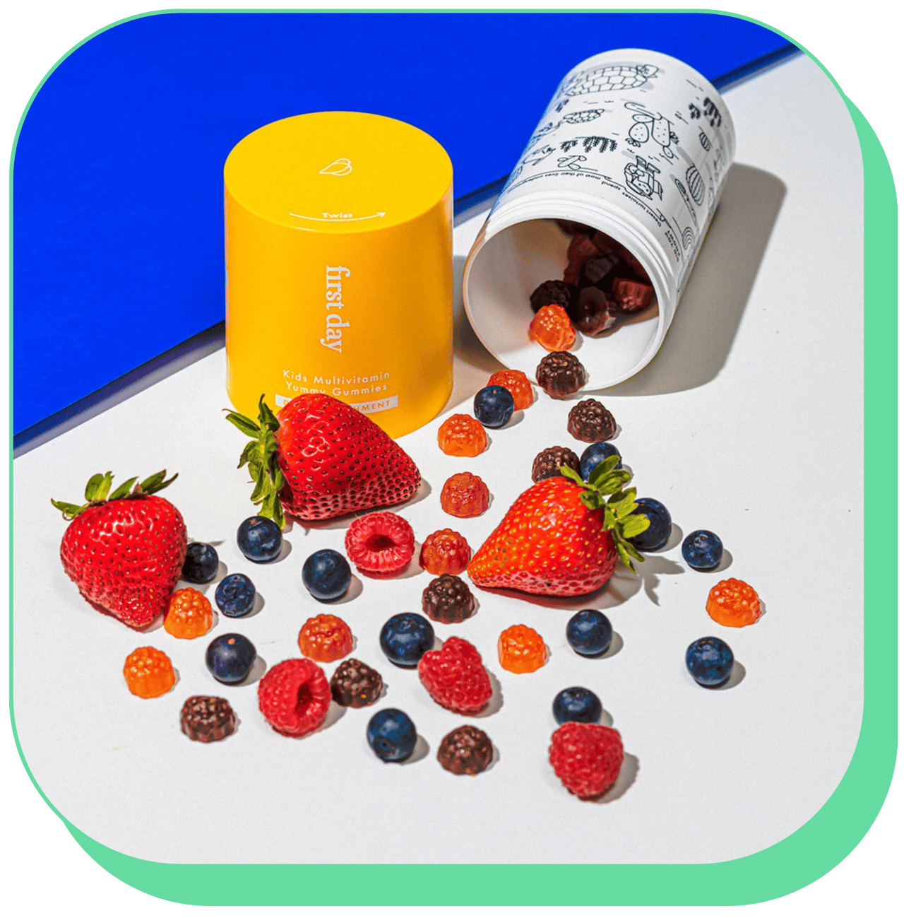 Colorful gummy vitamins and fresh berries on a white surface.
