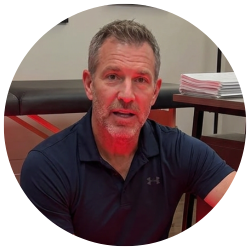 A circular portrait of a man in a polo shirt speaking, with a red light illuminating his face.