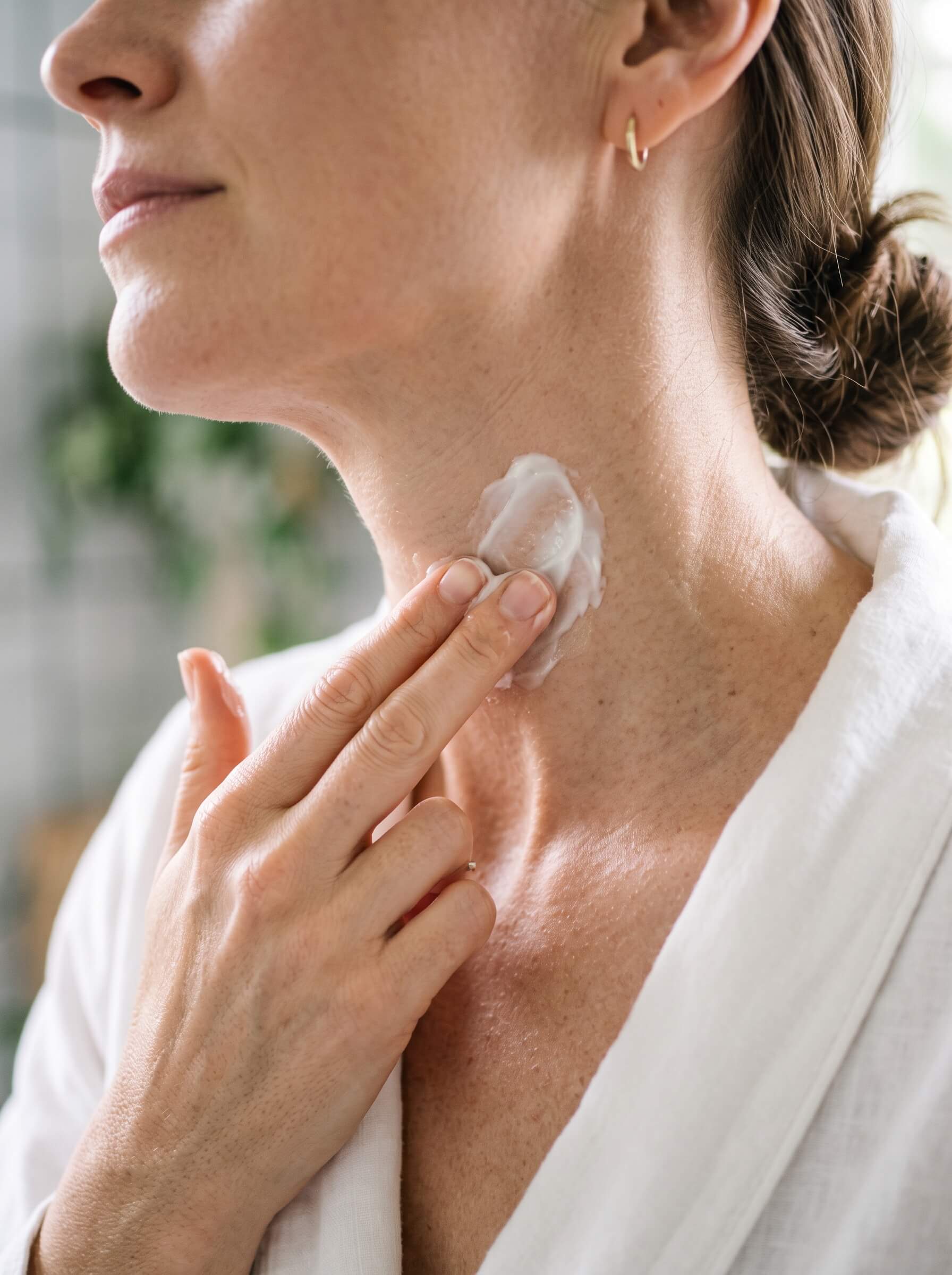 A person's hands hold an open packet of LTV Hydration and Liver Support dietary supplement.