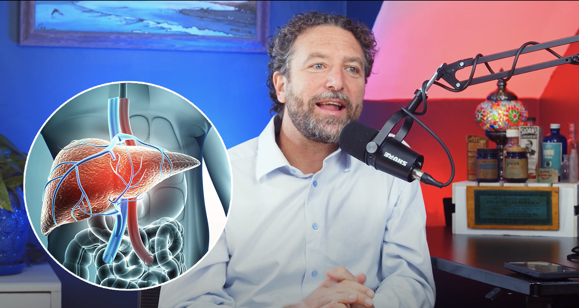 A man speaks into a microphone, with a medical illustration of a human liver displayed next to him.