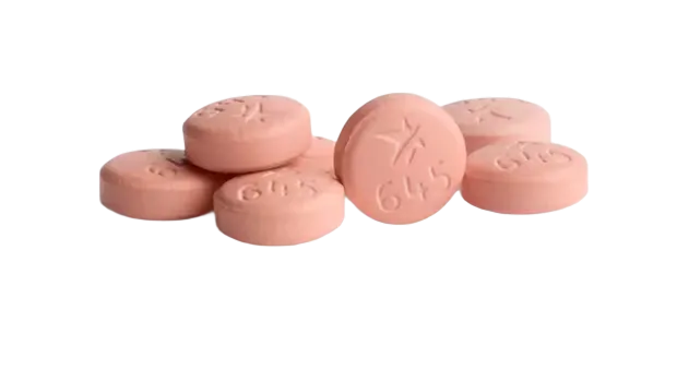 Seven orange tablets with a star and numbers imprinted on them.