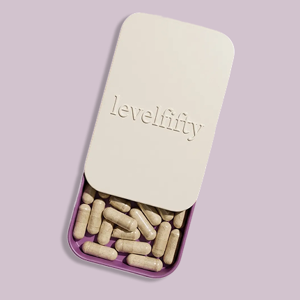 Rectangular tin with 'levelfifty' and capsules inside.