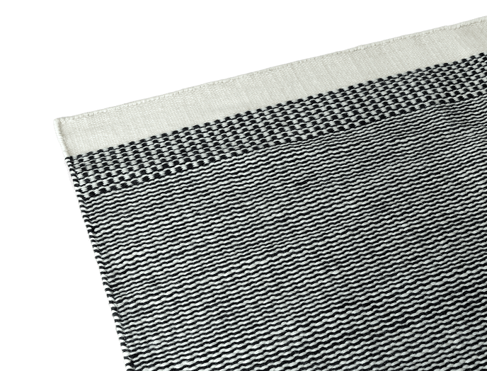 Black and white woven fabric with striped patterns.