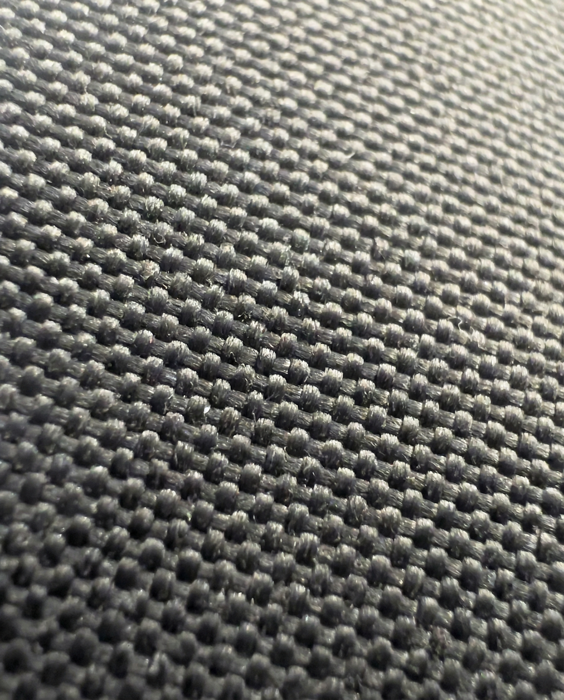 Close-up of gray woven fabric texture.